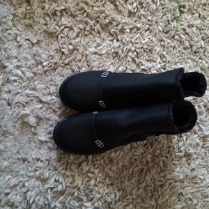 Black moccasin boots